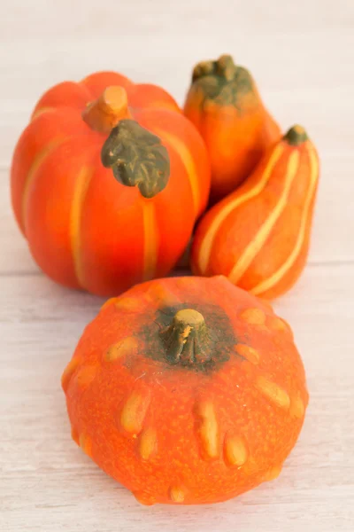 Orange pumpkins on a wooden background — Stock Photo, Image