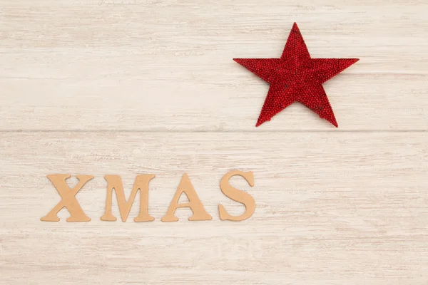 Estrela de Natal vermelho com a palavra Xmas — Fotografia de Stock