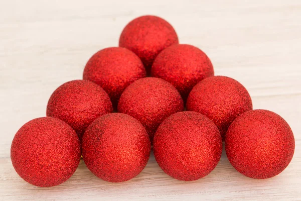 Red Christmas balls with glitter triangle shaped — Stock Photo, Image