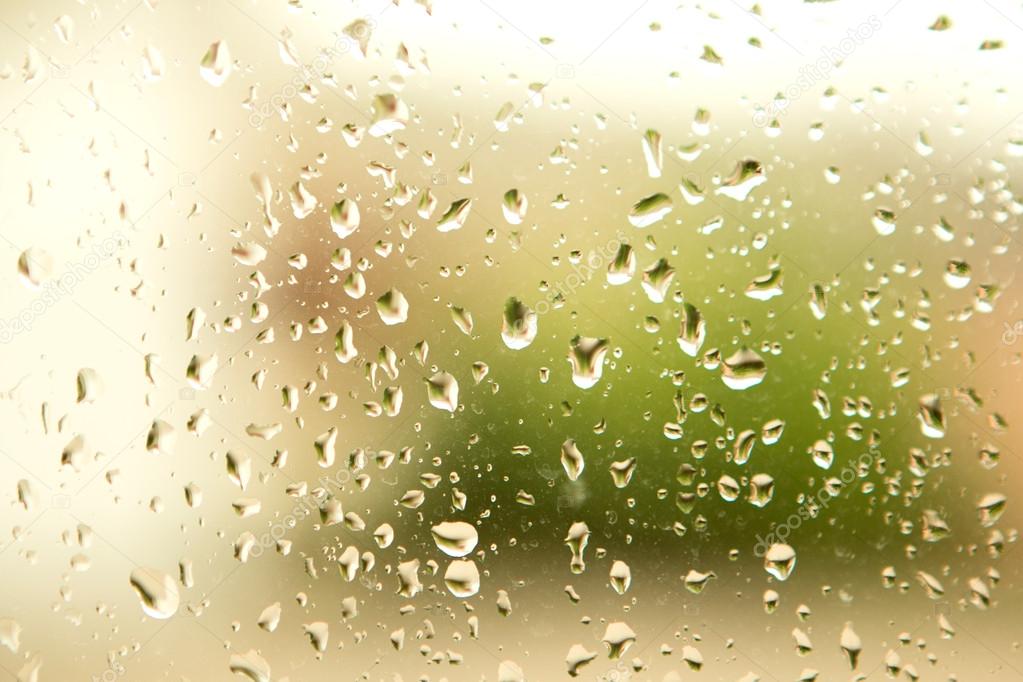 Glass with drops of rain water 
