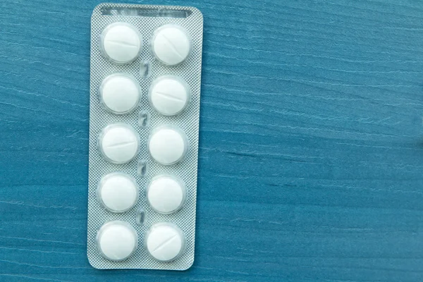 Packings of white pills of medicines — Stock Photo, Image