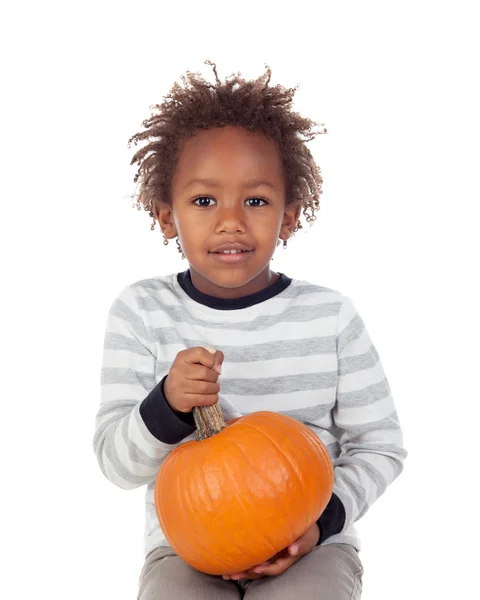 Funny African boy with pumpkin — ストック写真