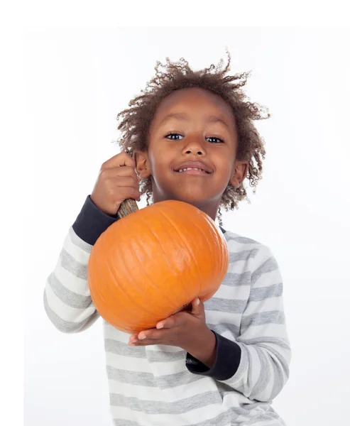 Funny African boy with pumpkin — Stock Photo, Image
