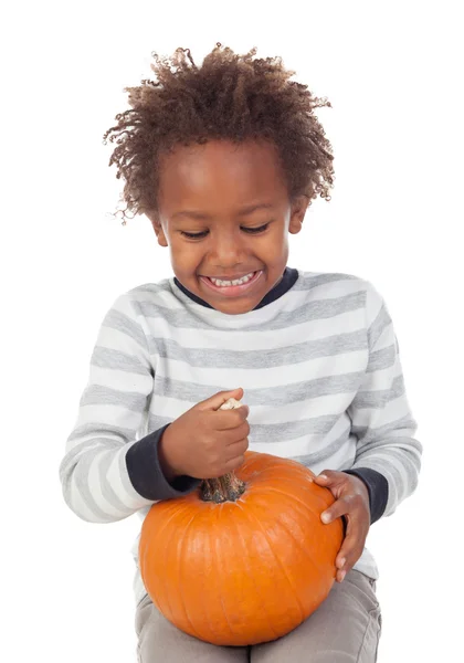 Funny African boy with pumpkin — Stock Photo, Image