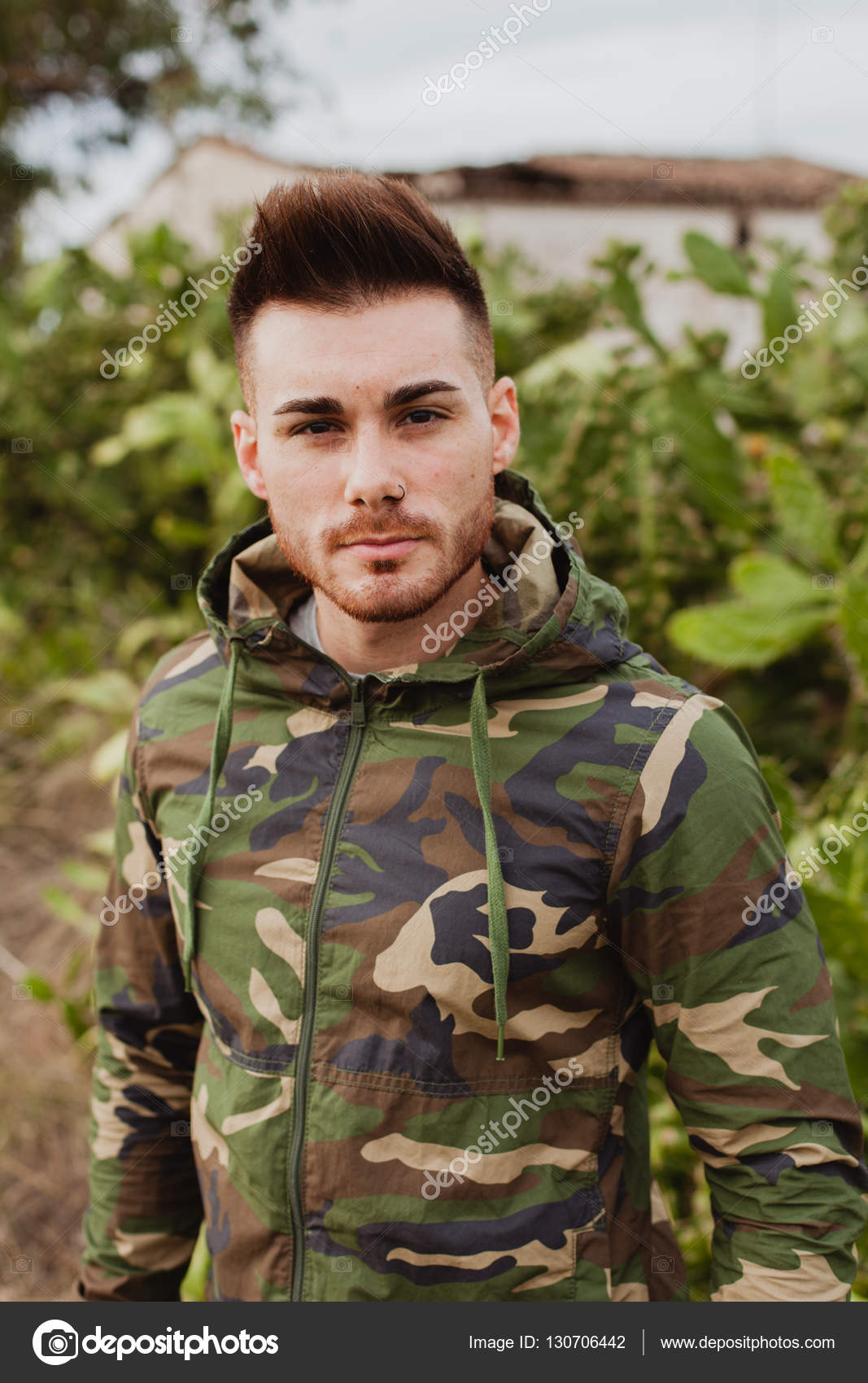 Attractive guy with military jacket Stock Photo by ©Gelpi 130706442