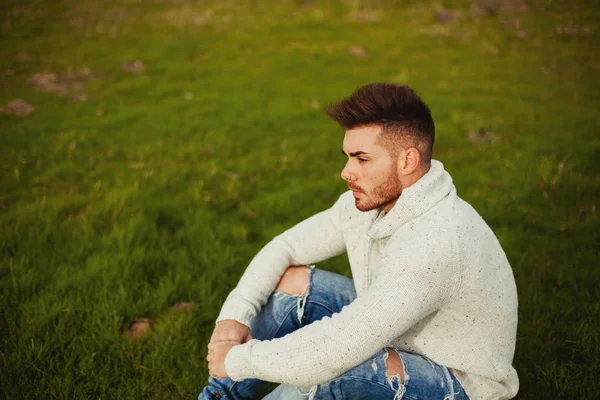 Attractive guy in meadow — Stock Photo, Image