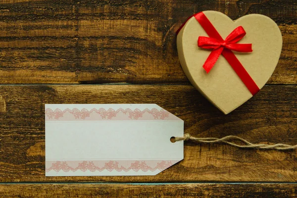 Gift with red ribbon — Stock Photo, Image