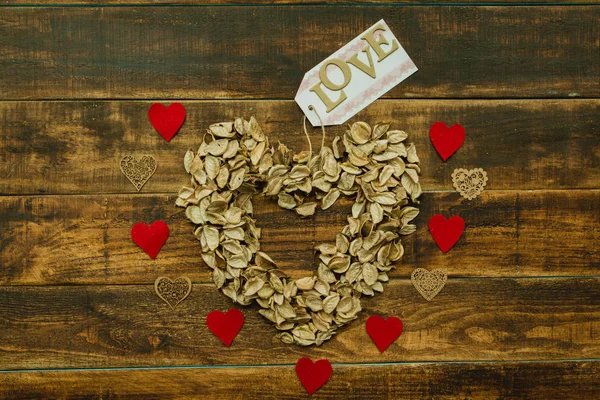 Heart made of dry petals — Stock Photo, Image