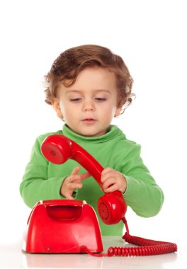 kırmızı telefon ile erkek bebek