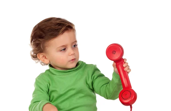 Baby boy with red phone — Stock Photo, Image