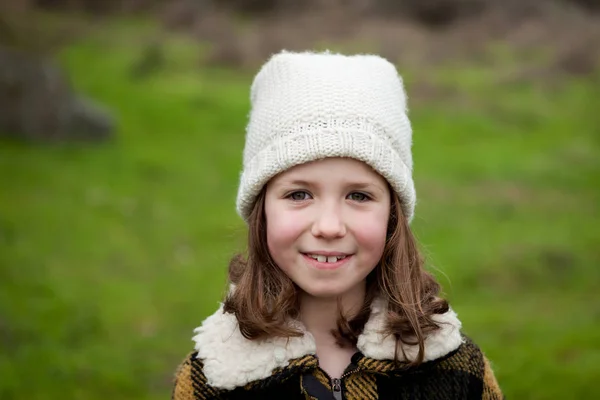 Girl in warm coat outdoors — Stock Photo, Image