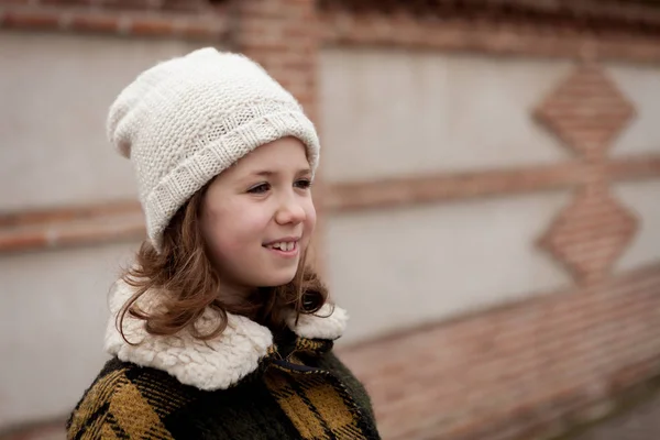 Girl in warm coat outdoors — Stock Photo, Image