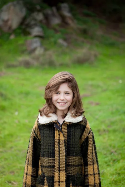 Girl in warm coat outdoors — Stock Photo, Image