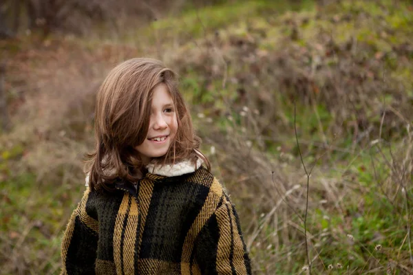 Girl in warm coat outdoors — Stock Photo, Image