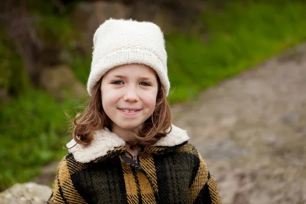 Girl in warm coat outdoors — Stock Photo, Image