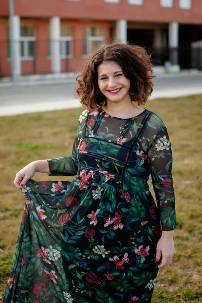 Curvy girl with flowered dress — Stock Photo, Image