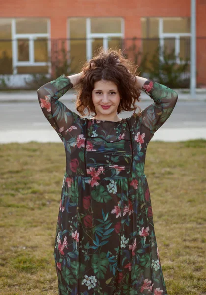 Curvy girl with flowered dress — Stock Photo, Image