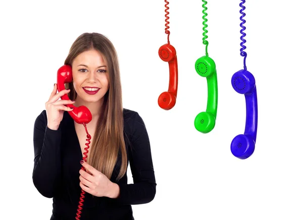 Stilvolle Frau mit rotem Telefon und bunten Telefonen — Stockfoto