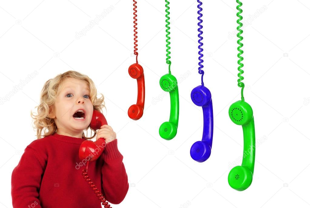 Funny little child talking by phone
