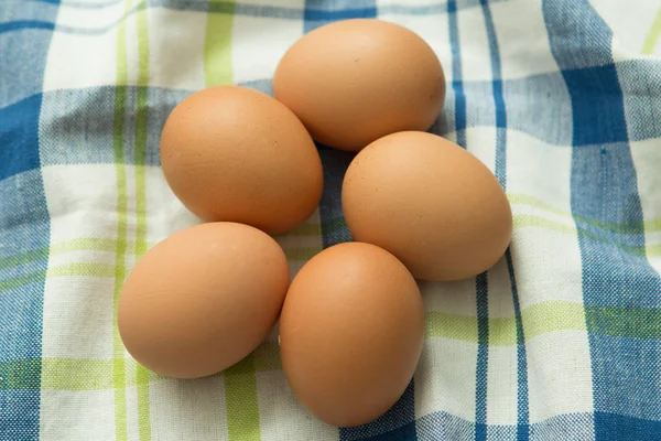 Raw eggs on napkin — Stock Photo, Image