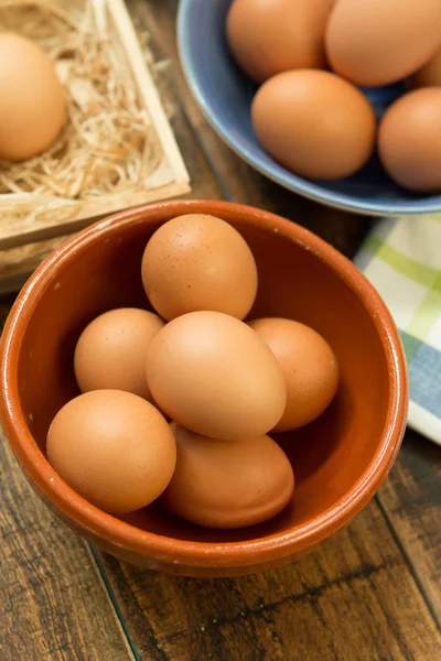 Raw eggs in bowls — Stock Photo, Image