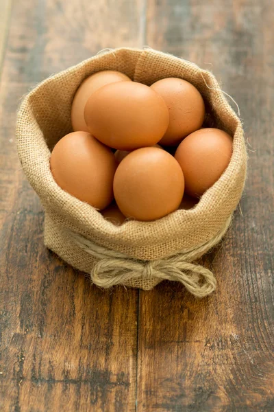 Raw eggs in sack — Stock Photo, Image