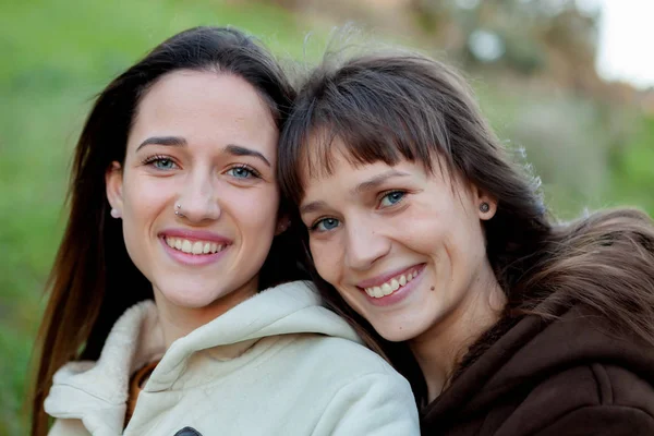 Young sisters in park Stock Photo