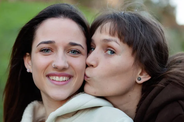 Young sisters in park Royalty Free Stock Photos