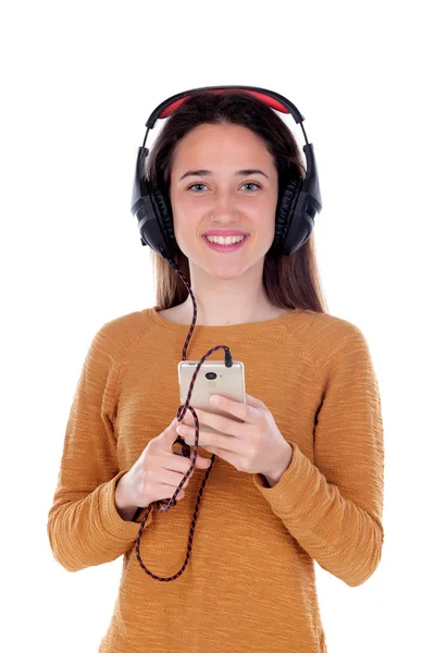 Tonåring flicka lyssnar musik med hörlurar — Stockfoto