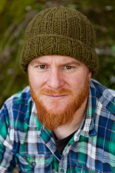 Red bearded man in plaid shirt — Stock Photo, Image