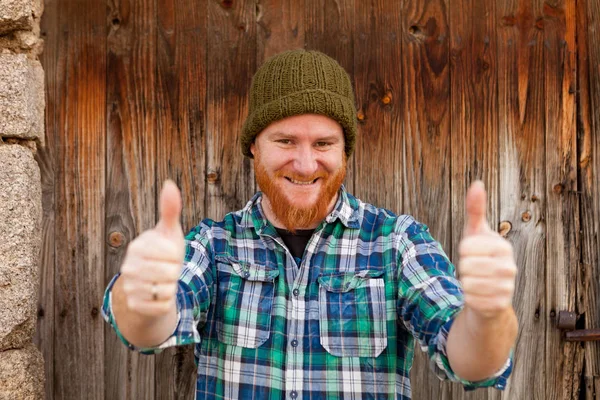 Red bearded man in plaid shirt