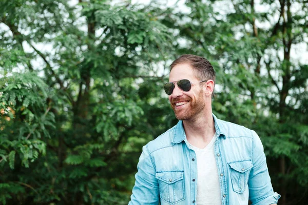 Casual guy relaxed in park — Stock Photo, Image