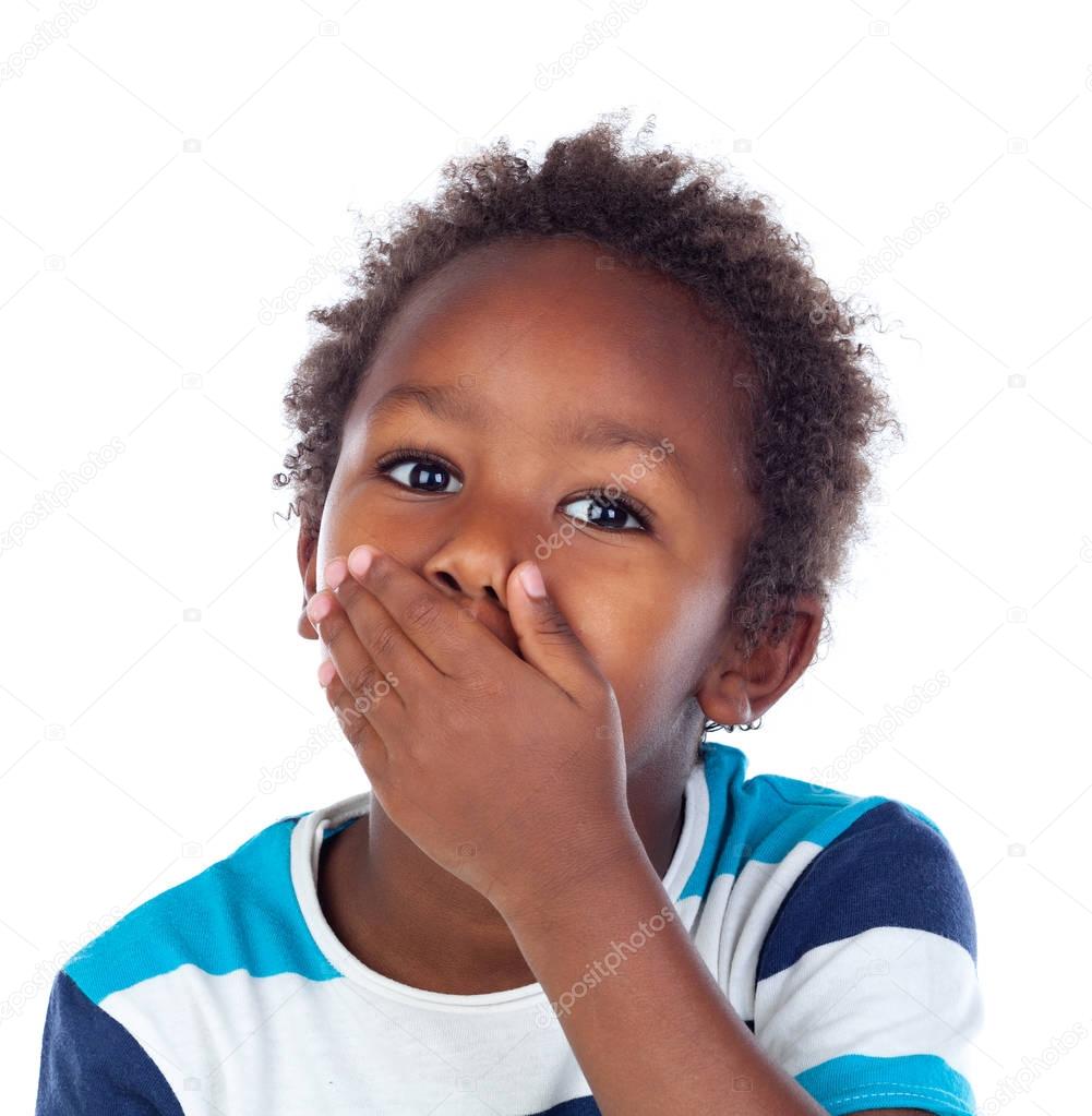Little african boy covering his mouth