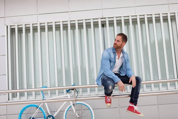 Casual guy with vintage bike Stock Image