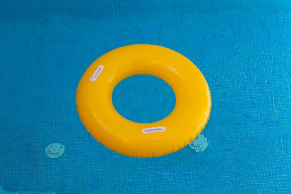 Yellow float on pool — Stock Photo, Image