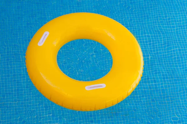 Yellow float on pool — Stock Photo, Image