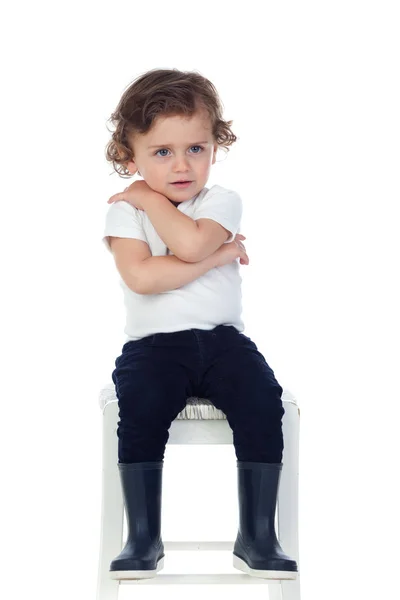 Menino usando botas — Fotografia de Stock