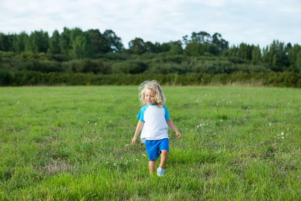 Child with long blond hair — Stock Photo, Image