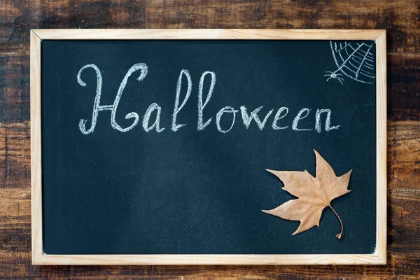 Blackboard with word Halloween — Stock Photo, Image