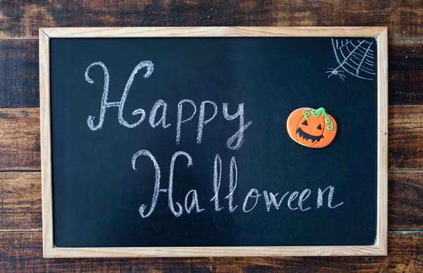 Blackboard with words Happy Halloween — Stock Photo, Image