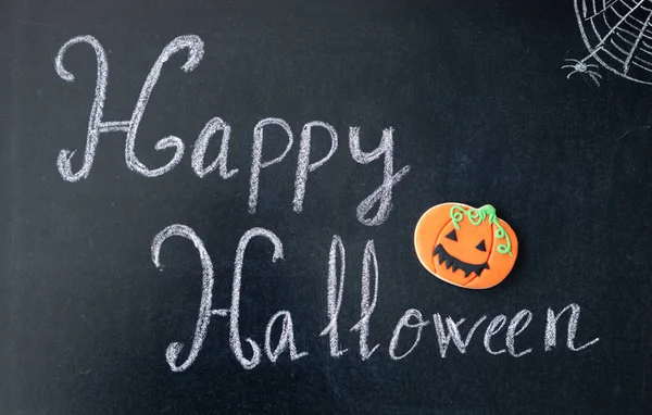 Blackboard with words Happy Halloween — Stock Photo, Image