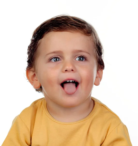 Adorable little boy showing tongue — Stock Photo, Image