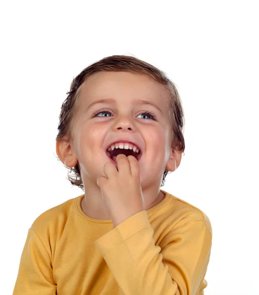 Adorable petit garçon montrant des dents Image En Vente