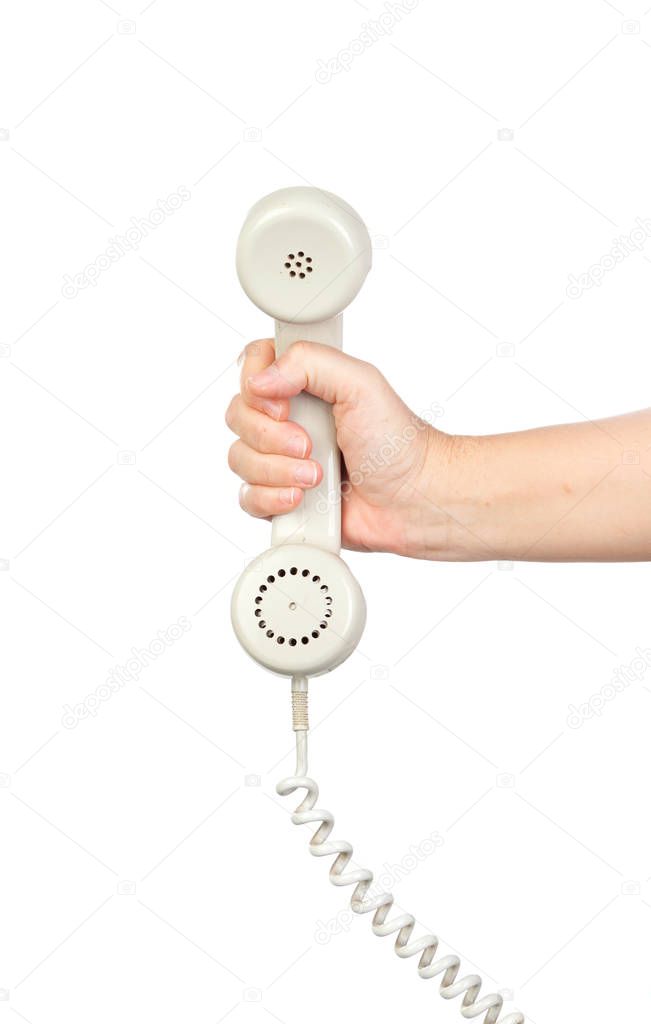 male hand holding white vintage telephone handset isolated on white background