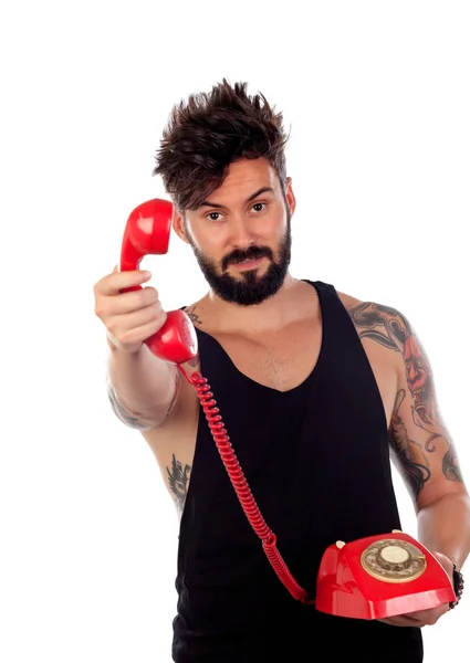 Joven con viejo teléfono rojo — Foto de Stock