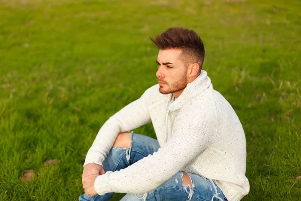 Attractive Guy Sitting Grass Green Meadow — Stock Photo, Image