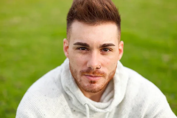 Attractive Guy Sitting Grass Green Meadow — Stock Photo, Image