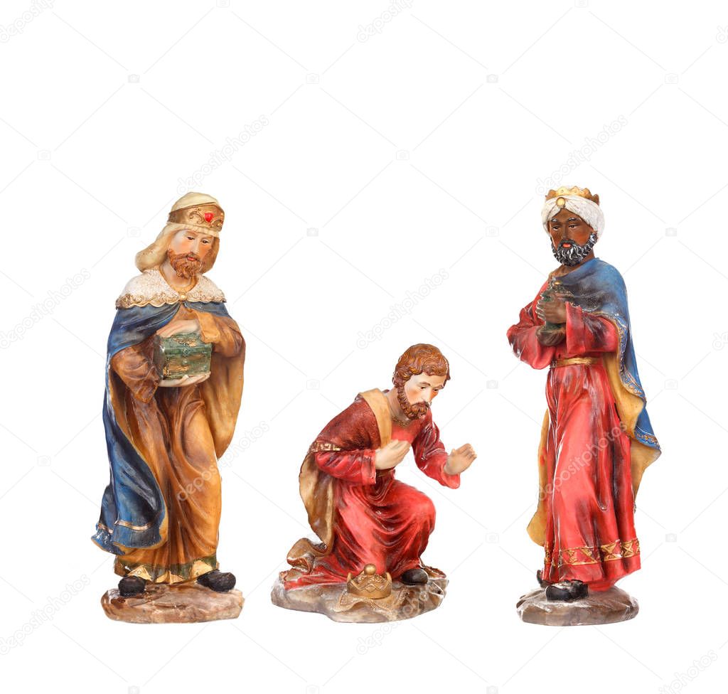 three wise men. Ceramic figures isolated on white background