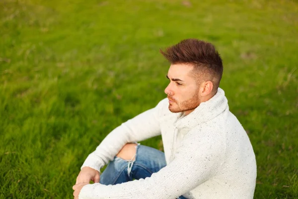 Attractive Guy Sitting Grass Green Meadow — Stock Photo, Image