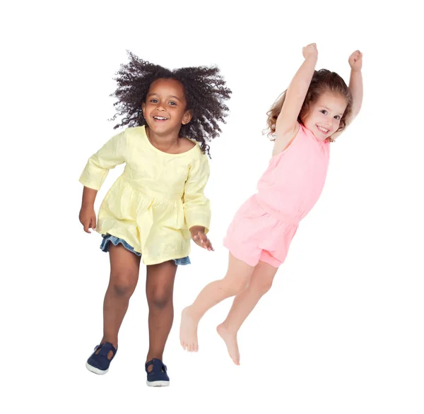 Две Счастливые Девушки Прыгают Изолированные Белом Фоне — стоковое фото